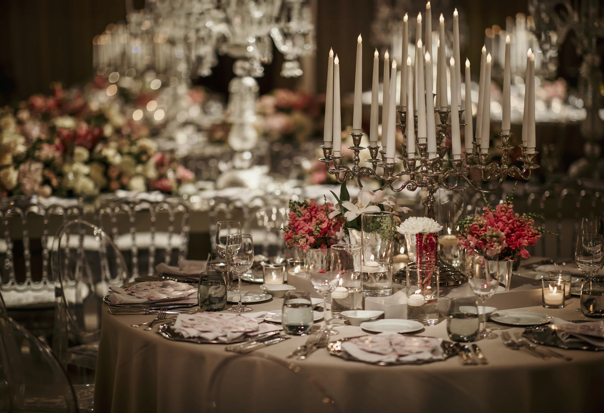 Beautiful table setting for family Christmas dinner. Cozy atmosphere, candlelight on tall candelabras. stock photo Beautiful table setting for family Christmas dinner. Cozy atmosphere, candlelight on tall candelabras. stock photo