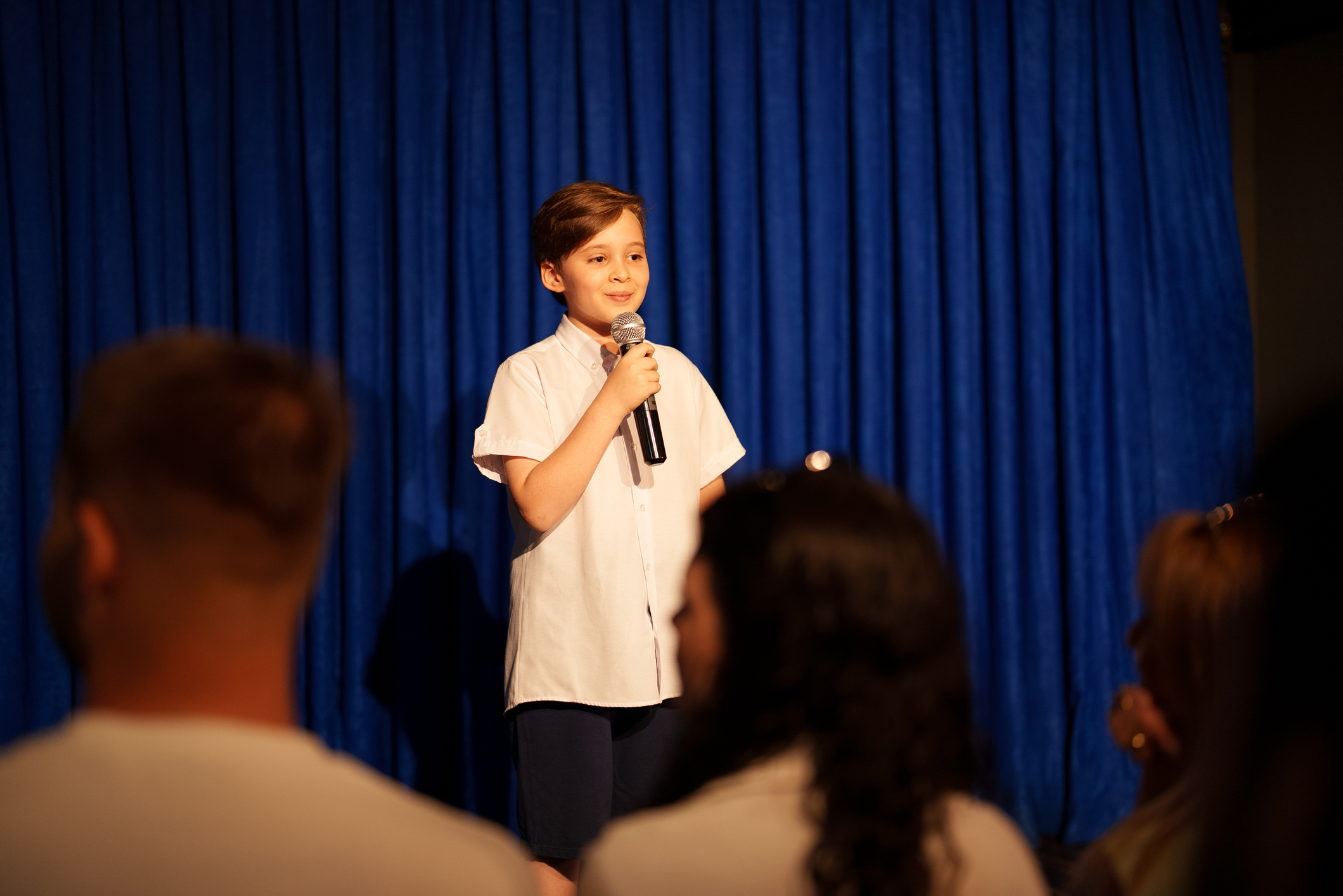 child performing on stage